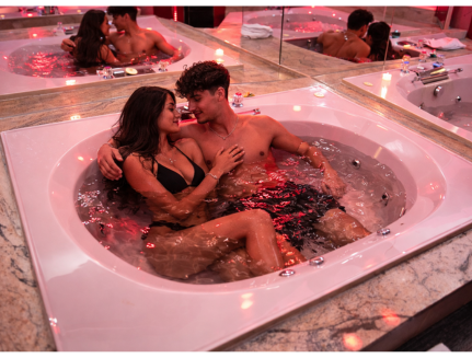 Couple Relaxing in Private Jetted Hot Tub Inn Of The Dove
