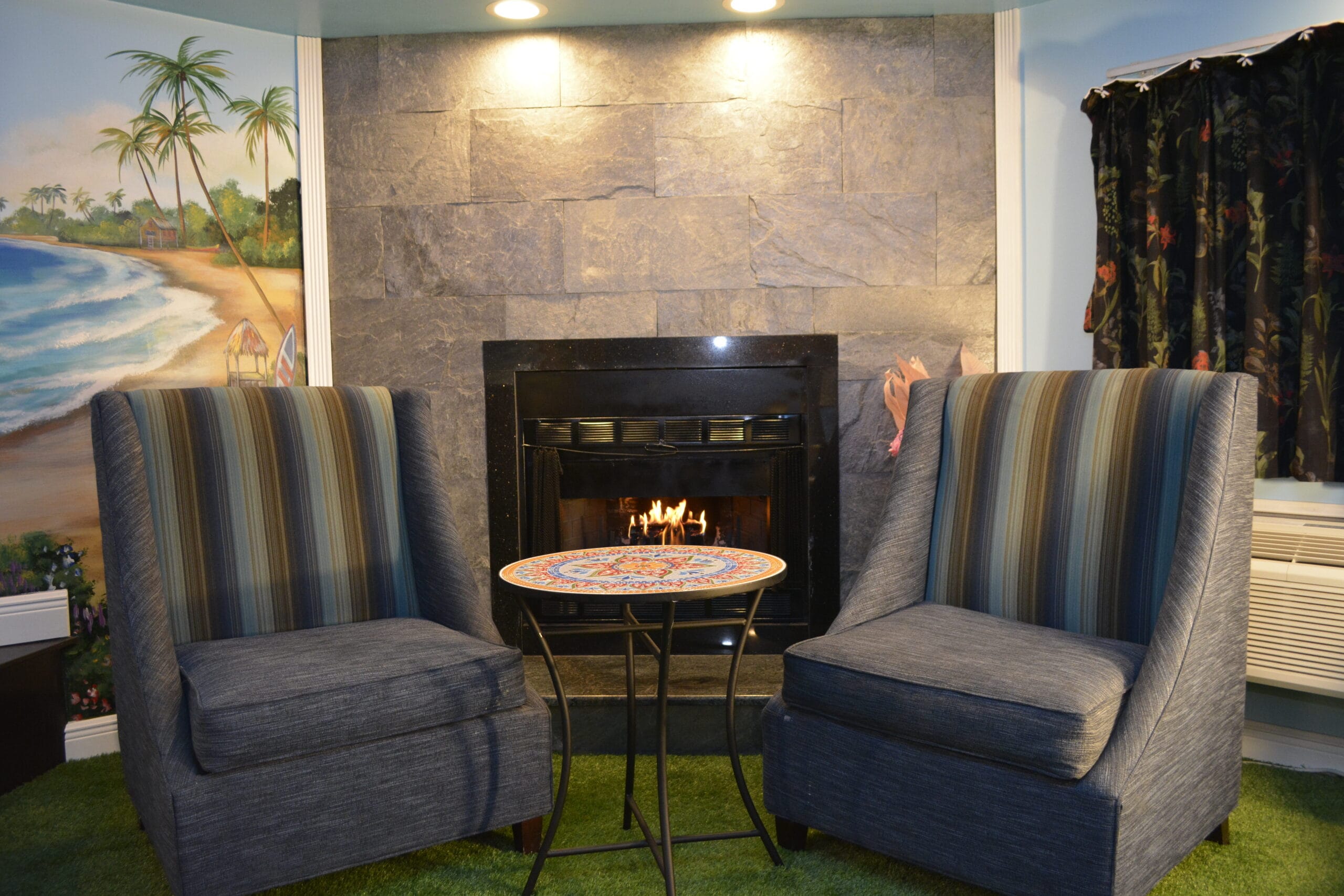 Hawaiian Paradise themed suite fireplace seating area, Inn of the Dove Harrisburg PA