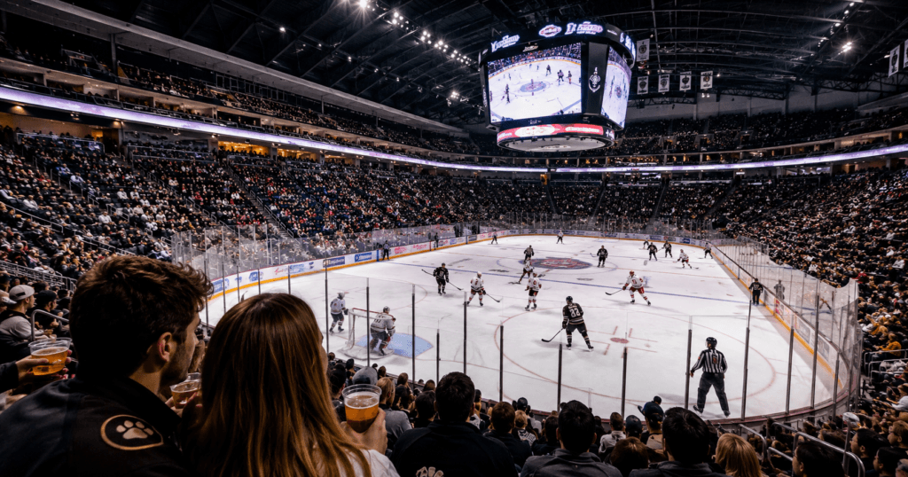 Couple watching a Hershey Bears hockey game at Giant Center arena